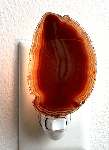 Amber agate crystal geode night light with natural patterns, adding a calming glow to any room