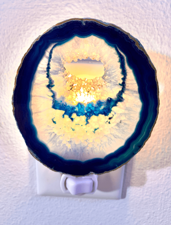 Blue agate crystal geode night light with natural patterns, adding a calming glow to any room