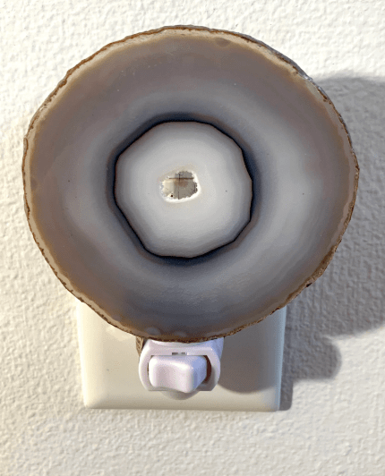 Natural agate crystal geode night light with natural patterns, adding a calming glow to any room