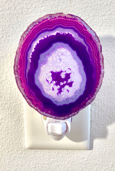 Purple agate crystal geode night light with natural patterns, adding a calming glow to any room
